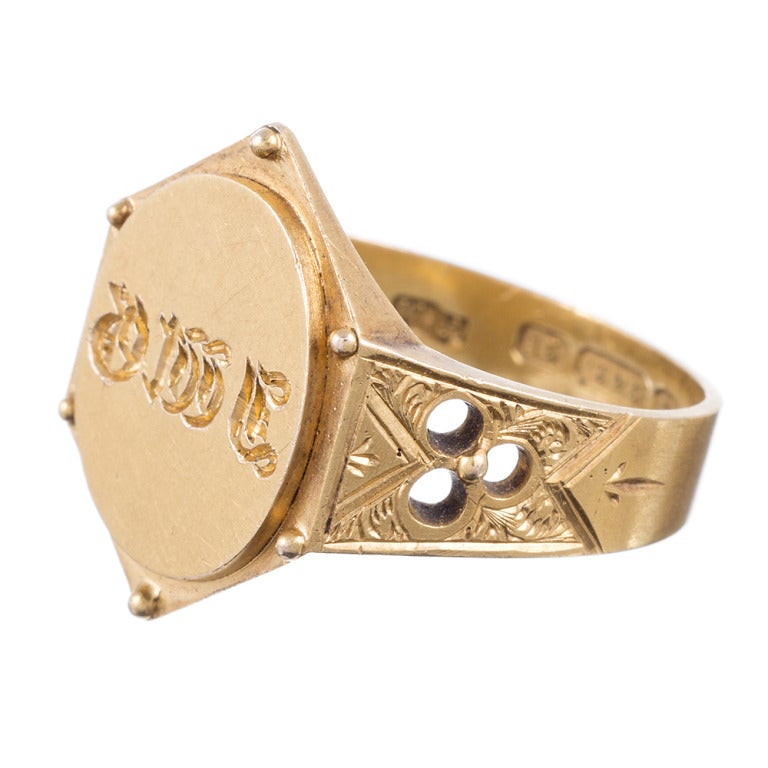 15k yellow gold signet ring with a unique hexagonal shape and an extraordinary amount of detail. The sides of the shank are hand engraved with a scrolling deign and the back of the ring has a long engraving, dated March 1st, 1877.