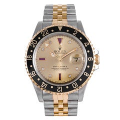 Rolex Rare Stainless Steel and Yellow Gold GMT-Master with Ruby "Serti" Dial