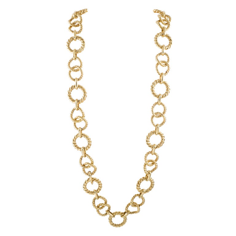 Heavy links of twisted 18k yellow gold alternating sizes, connected by high polished bridges. In all, 31 inches long and finished with a substantial clasp. Wear it as a necklace, wear it doubled around your neck or wear it as a belt!
