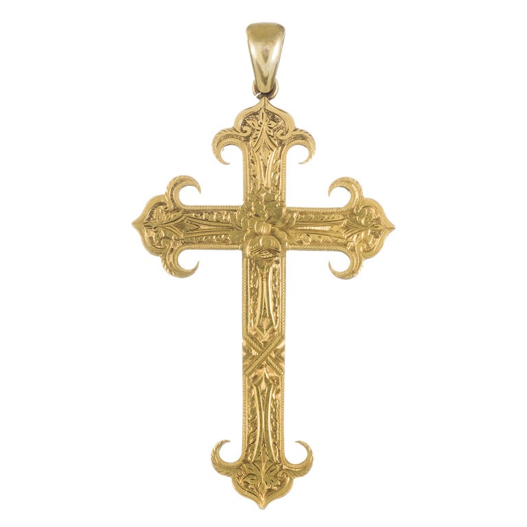 Measuring an impressive 3 inches long (with the bale) and 1.75 inches wide, this Victorian cross pendant is a fantastic example of antique finery. Super-detailed engraving and stylized tips add much interest to this classic. 

circa 1890