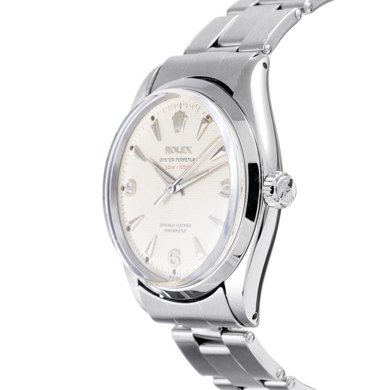 This watch contains every celebrated element of vintage Rolex: Original stylized hands, raised markers, an original 1950s Oyster bracelet and a unique-to-1950s-watches textured-linen-style dial with the additional 