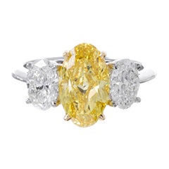 2.42 Carat Fancy Vivid Yellow Three-Stone Oval Diamond Ring