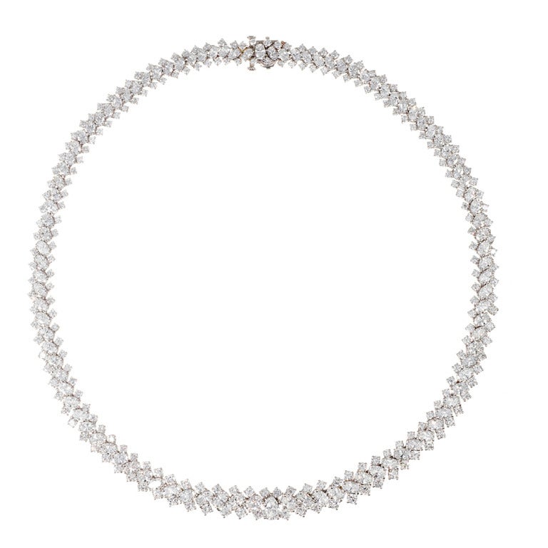 This is the epitome of fine contemporary jewelry and would be an ideal (and, perhaps more wearable) alternative to a traditional diamond riviere necklace. The diamonds exhibit very fine F-G color and Vs clarity, weighing 27.50 carats in total.