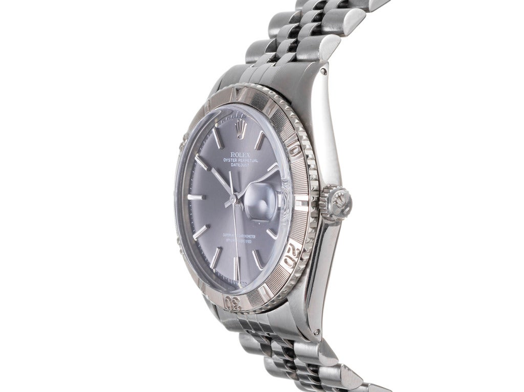 A handsome stainless steel wristwatch with a sporty kick, the Rolex Turn-o-Graph is the only non-professional watch that Rolex offered with a rotatable bezel. No longer offered, this piece is fitted with a rhodium 