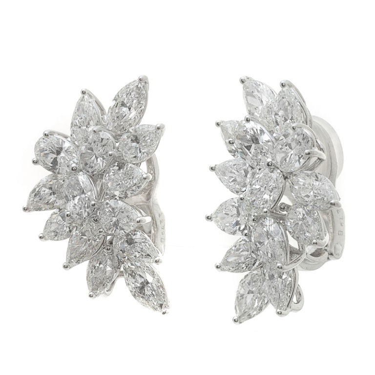 Glamorous leaf like earrings boasting 10 carats in diamond weight.  Earrings measure slightly over one inch in length.  Truly luminous!  Old Hollywood glamour yet wearable today....or, tonight!