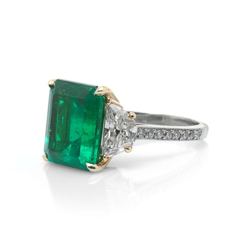 emerald cut with half moon side stones