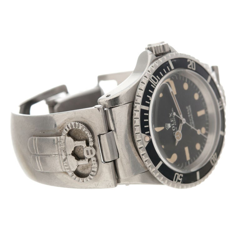 This Submariner (reference#5513) features rare military meters dial and a custom made 