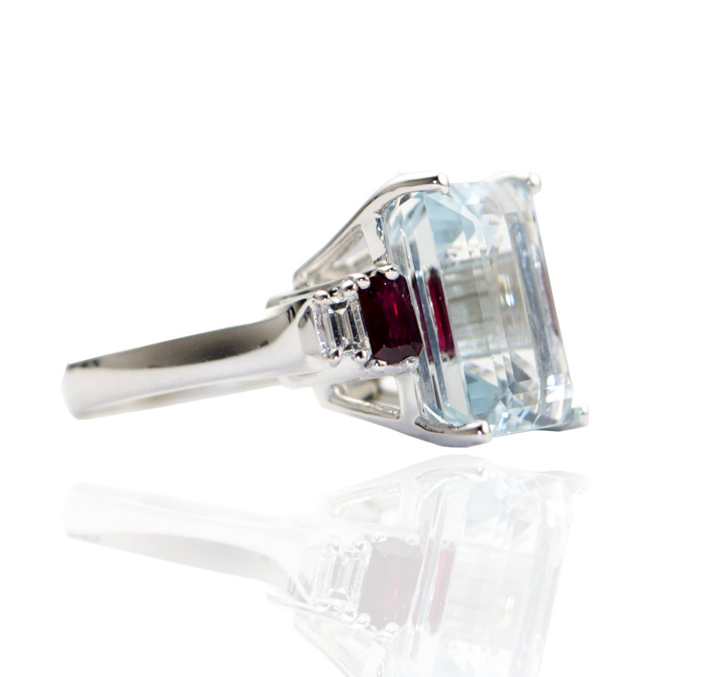 18K White Gold Ring with Aquamarine (cts 12.60) Baguette Rubies (cts 0.78) Baguette Diamonds (cts 0.22) E color VVS Clarity