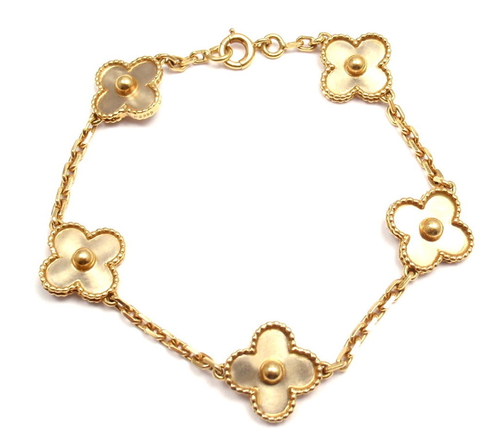 18k Yellow Gold Alhambra 5 Motif Bracelet by Van Cleef & Arpels. Part of Van Cleef & Arpels' Alhambra Vintage Collection. 

Details: 
Length: 7 1/4''
Links are 3mm each
Clovers are 14mm each
Weight: 13 grams
Stamped Hallmarks: VCA 750