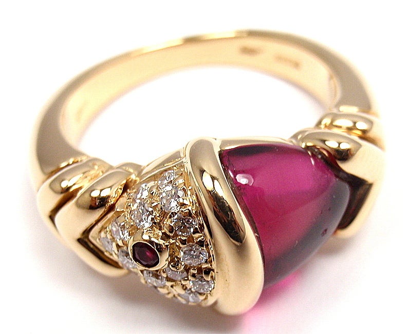18k Yellow Gold Diamond & Pink Tourmaline Naturalia Fish Ring by Bulgari. With 16 Diamonds, G Color And VVS Clarity. Total Diamond Weight: .25ct. One pink tourmaline: 10mm x 9mm. And one small round ruby stone. 

Details: 
Weight: 7.9 grams
Ring