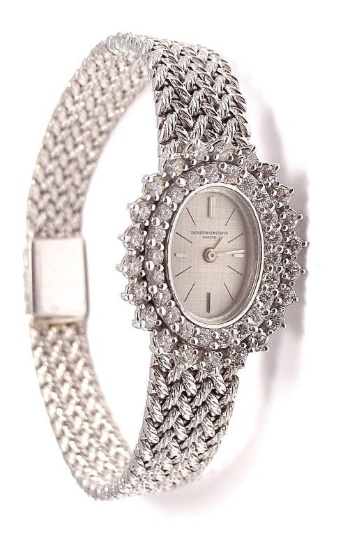 Lady's 18k White Gold and Diamond Bracelet Watch by Vacheron & Constantin. 
Manual-wind movement, 17 jewels. 18k white gold oval case, diamond-set bezel, back winding crown, case back secured by two screws. 18k white gold integrated woven