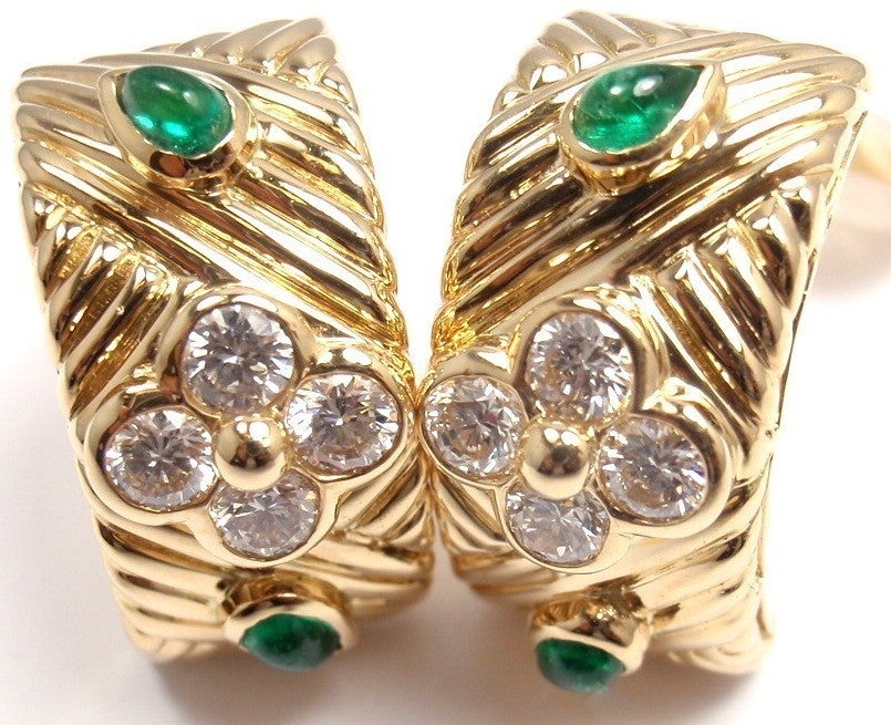 18k Yellow Gold Diamond And Emerald Flower Hoop Earrings by Christian Dior. 
With 4 pear shape cabochon emeralds and
8 round brillant cut diamonds VVS1 clarity, E color.
Total Diamond Weight approx. .80ct 
These earrings come with original