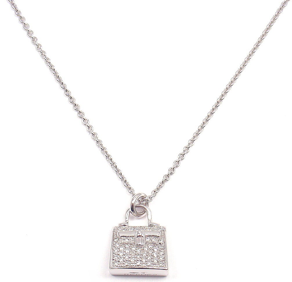 18k White Gold Diamond Kelly Pendant Necklace by Hermes. With 44 Round Brilliant Cut Diamonds, VS1 Clarity, G Color. Total Diamond Weight: .44CT. 

Details: 
Length: 15.5