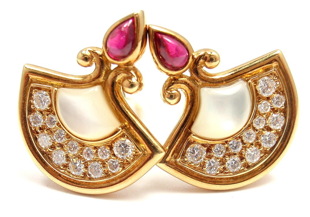 18k Yellow Gold Diamond Ruby Mother of Pearl Fan Earrings by Christian Dior. 
With 26 diamonds, approx .80 ctw total
VVS1 clarity, E color total weight approx. .80ct
2 rubies, teardrop, 3x 5mm
2 mother of pearl, 8mm x 6mm

Details:
Weight: