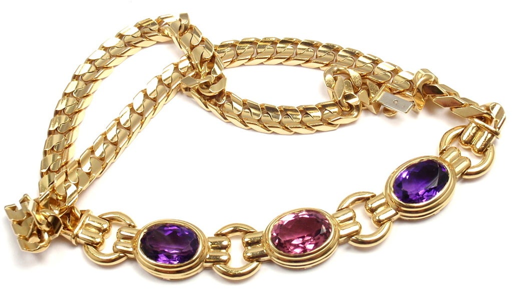 18k Yellow Gold Amethyst & Pink Tourmaline Link Necklace by Bulgari. This necklace comes with an original Bulgari box. With one faceted oval shaped pink tourmaline: 10 x 12mm. And two faceted oval shaped amethysts: 10 x 12mm.

Details: 
Length: