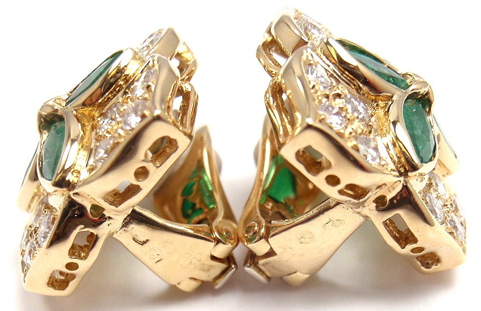 18k Yellow Gold Flower Diamond & Emerald Earrings by Christian Dior. With 8 emerald shaped emeralds. Total Emerald Weight: 2CT. With 32 round brilliant cut diamonds, VVS1 clarity, E color. Total Diamond Weight: 1.20CT.

Details:
Measurements: