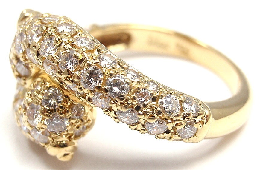 18k Yellow Gold Diamond Bypass Band Ring by Christian Dior. With round brilliant cut diamonds, VVS1 clarity, E color. Total Diamond Weight: 2CT. 

Details: 
Weight: 5.5 grams
Width: 12mm
Ring Size: 6
Stamped Hallmarks: Dior 750 024
*Free