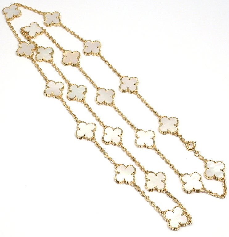 18k Yellow Gold Vintage Alhambra Mother of Pearl Necklace by Van Cleef & Arpels. This necklace comes with a VCA receipt from 2001. With 20 Mother of Pearl Motifs: 13mm x 12mm

Details: 
Length: 32