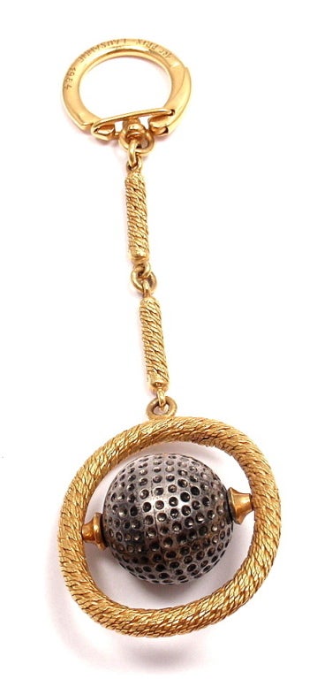 18k Yellow Gold Golf Ball Keychain by Patek Philippe. 

Details: 
Length: 4''
Width: 1.5