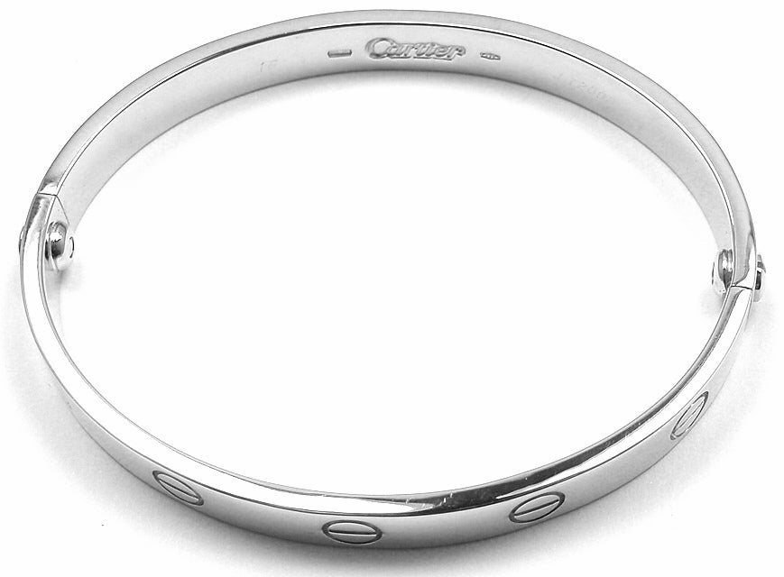 18k White Gold Love Bangle by Cartier. Size 16. This beautiful Cartier Love Bangle comes with an original Cartier box and Screwdriver.

Details: 
Size: 16
Weight: 31.1 grams 
Width: 6.5mm
Stamped Hallmarks: Cartier 750 16 J72098 1993
*Free