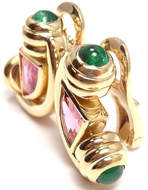 18k Yellow Gold Pink Tourmaline & Emerald Earrings by Bulgari. With 2 triangle pink tourmalines, 6mm x 8mm each. And 4 round emeralds, 4mm each. 

Details: 
Measurements: 18mm x 13mm
Weight: 16.3 grams
Stamped Hallmarks: Bvlgari 750
