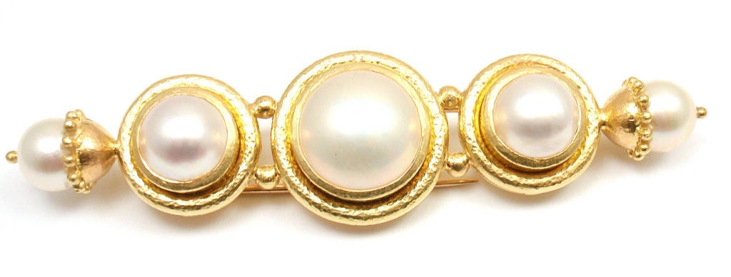 Hammered 18k Yellow Gold Mother of Pearl Brooch Pin by Elizabeth Locke. With 5 gorgeous Mother of Pearls. 

Details: 
Weight: 22.9 grams
Measurements: 3