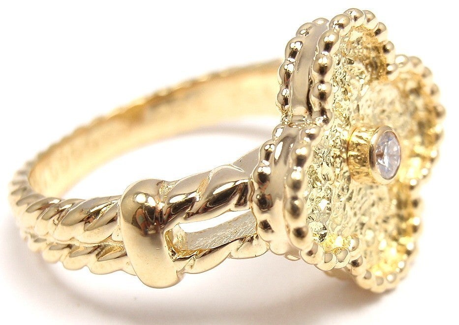 VAN CLEEF & ARPELS VCA VINTAGE ALHAMBRA 18K YELLOW GOLD DIAMOND RING.
Details:
Metal: 18k Yellow Gold
Size: 6.5
Measurements: 
Width: 15mm to 4mm
Weight: 7.8 grams
Stones:
1 round brilliant cut diamond VS1 clarity, F color appox.