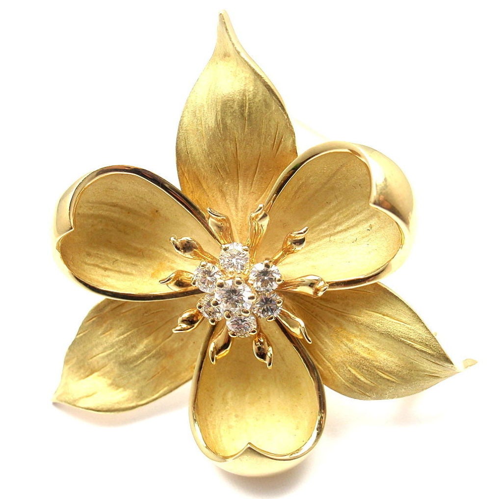 18k Yellow Gold Diamond Orchid Brooch by Tiffany & Co. With 7 brilliant cut diamonds, G/VS1. Total Diamond Weight: .60CT.

Details: 
Brooch Width: 43mm
Brooch Height: 45mm
Weight: 23.5 grams
Stamped Hallmarks: Tiffany & Co 750 
*Free Shipping