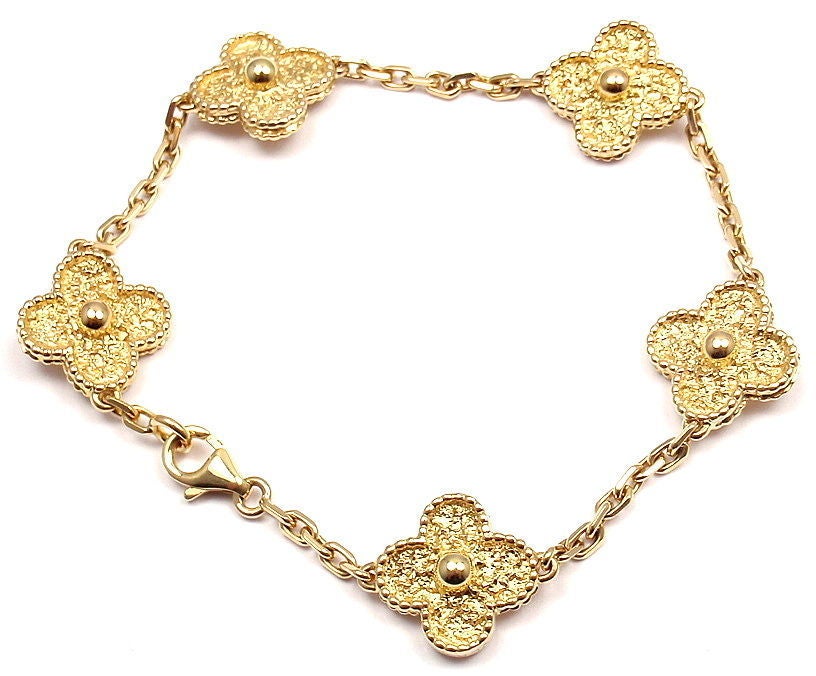 18k Yellow Gold Vintage Alhambra Yellow Gold Bracelet by Van Cleef & Arpels. With five Motifs made out of 18k Yellow Gold. 

Details: 
Length: 7