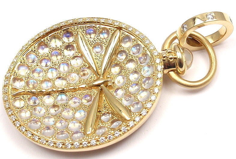 18k Yellow Gold Diamond & Moonstone Dragonfly Pendant by Temple St Clair. This piece comes with a pouch. With round brilliant cut diamonds. Total Diamond Weight: .41CT. Total Blue Moonstone Weight: 3.98CT. 

Details: 
Diameter: 29mm 
Length: