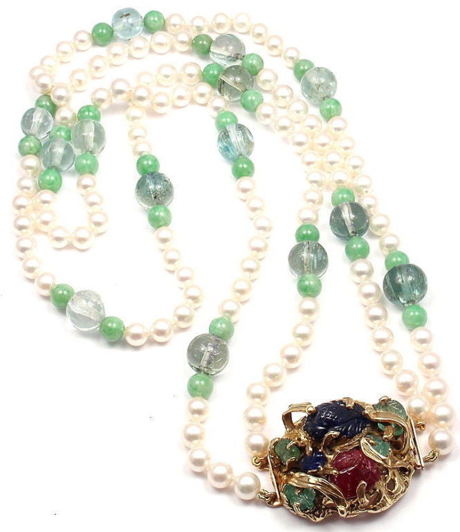 14K Yellow Gold Pearl, Aquamarine, Jade, Ruby, Sapphire, Emerald Necklace by Seaman Schepps. 

Stone Details: 
108 cultured pearls: 7.5mm - 6.8mm
14 aquamarine beads: 13mm - 10mm
28 jade beads: 7.5mm
1 Carved Ruby: 13mm x 13mm
2 Carved