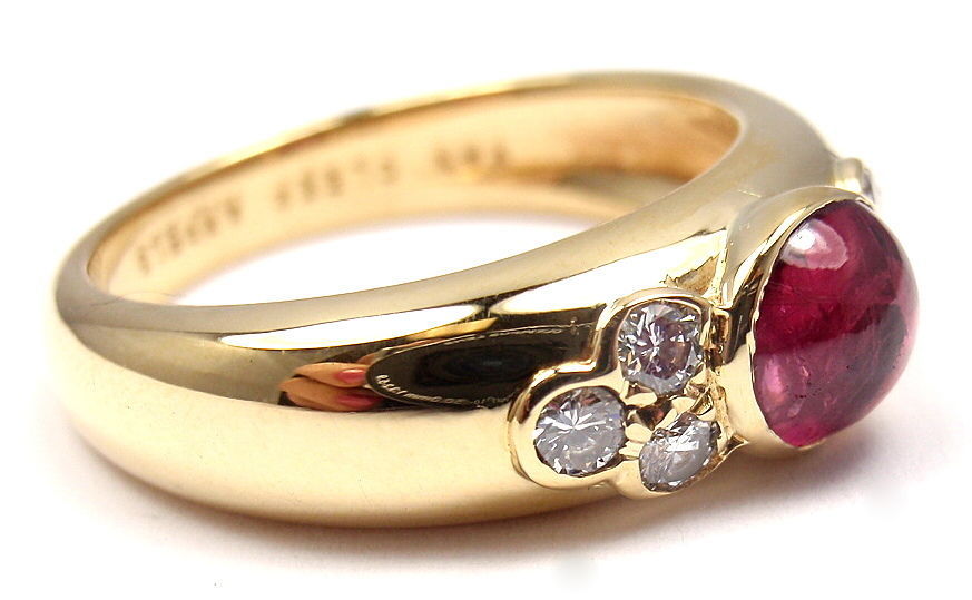 18k Yellow Gold Diamond & Ruby Ring by Van Cleef & Arpels. With 6 round brilliant cut diamonds, VVS clarity, E color. Total Diamond Weight: .25CT. And 1 round shaped cabochon ruby. Total Ruby Weight: .50CT.

Details: 
Ring Size: 5.5 
Weight: 6.4