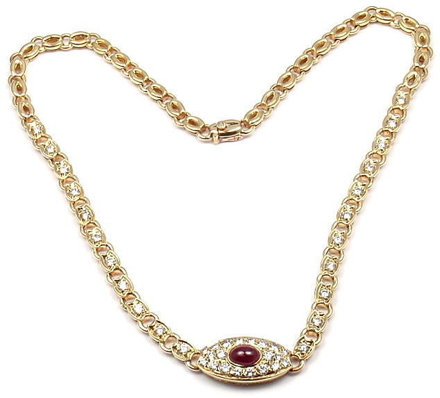 18k Yellow Gold Diamond & Ruby Necklace by Van Cleef & Arpels. With 52 round brilliant cut diamonds, VVS clarity, E color. Total Diamond Weight: 3CT. And 1 Oval-Shaped Cabochon Ruby. Total Ruby Weight: 1CT.

Details: 
Length: 15