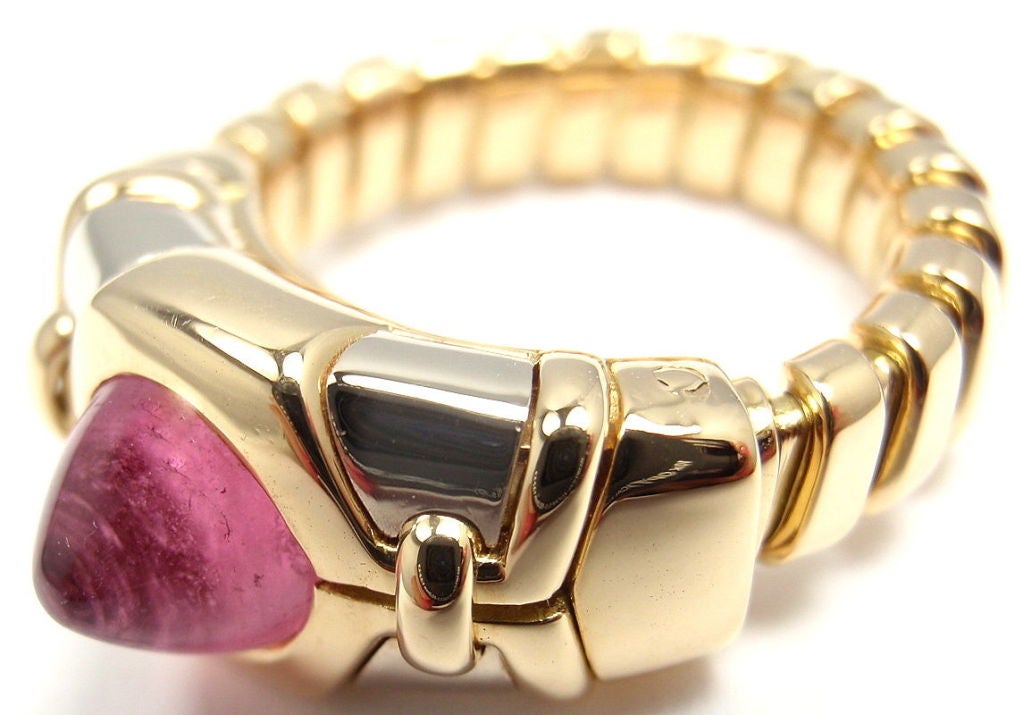 18k Yellow Gold Tubogas Pink Tourmaline Ring By Bulgari. With one pink tourmaline 6mm in diameter.

Details: 
Ring Size: 6 to 9.5 this band is adjustable
Width: 10mm
Weight: 11.7 grams
Stamped Hallmarks: Bvlgari 750 26AL

*Free Shipping