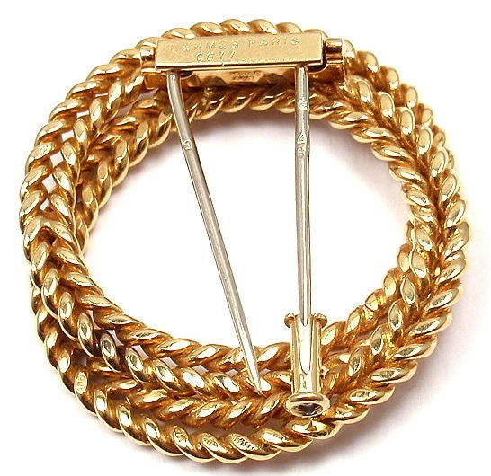 18k Yellow Gold Brooch by Hermes.

Details: 
Measurements: 40mm x 35mm
Weight: 18 grams
Stamped Hallmarks: Hermes Paris 6677 18k Made France French Hallmarks

*Free Shipping within the United States*

YOUR PRICE: $3,600