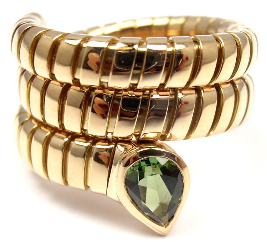 18k Yellow Gold Peridot Coil Snake Ring by Bulgari. With One Pear-Shaped Peridot Stone: 6mm x 4mm. 

Details: 
Ring Size: 6-9 (the ring stretches)
Weight: 14.6 grams
Stamped Hallmarks: Bvlgari 750
*Free Shipping within the United