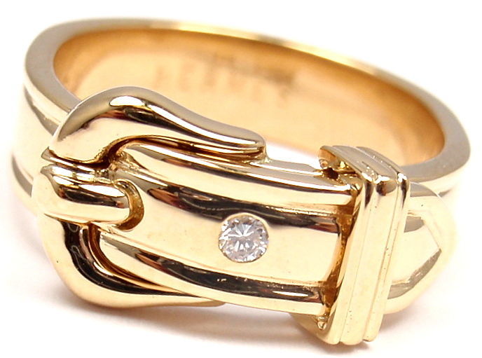 18k Yellow Gold Diamond Buckle Ring by Hermes. 
With 1 Round Brilliant Cut Diamonds, VS clarity, G color. Total Diamond Weight: .5ct.

Details: 
Ring Size: US 5 1/4 Europe 50
Weight: 6.4 grams
Width: 9mm
Stamped Hallmarks: HERMES 750 50 25872