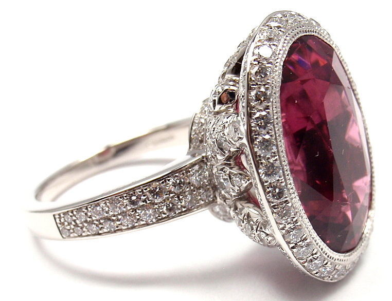 Platinum Pink Tourmaline & Diamond Ring by Tiffany & Co France. WIth one oval shaped pink tourmaline: 18mm x 14mm. Total Pink Tourmaline Weight: 12CT. And 173 round brilliant cut diamonds, VS1 clarity, G color. Total Diamond Weight 2CT. 

Details: