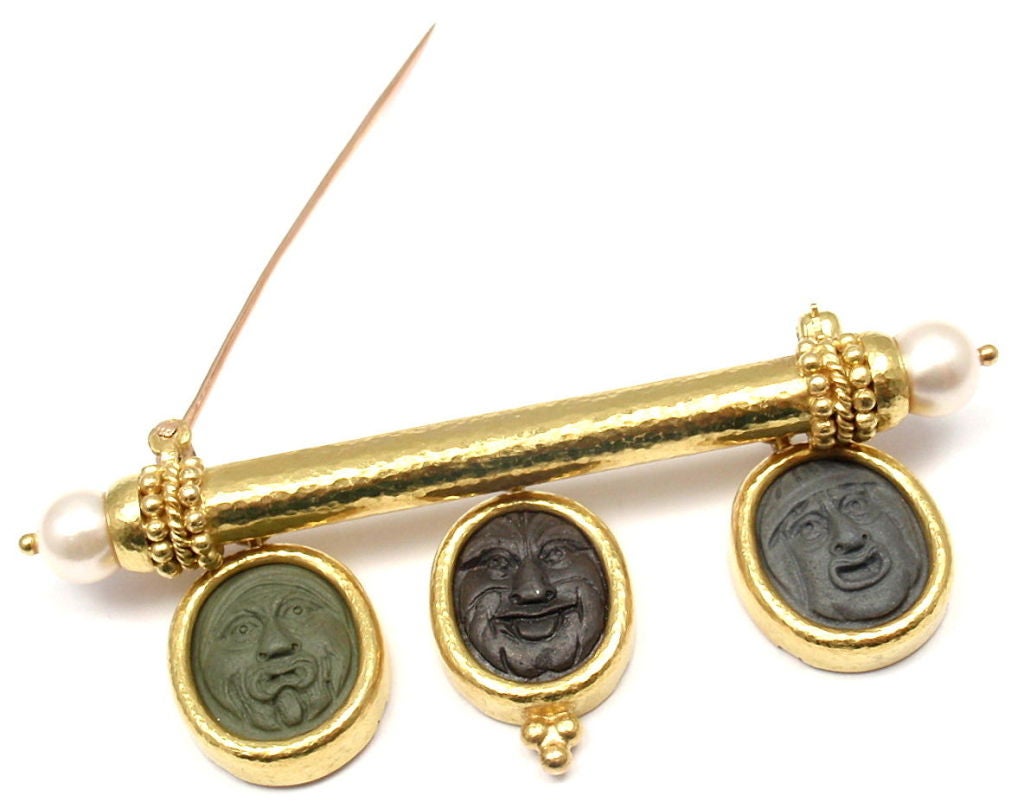 18k Yellow Gold Carved Lava Cameo Pearl Brooch Pin by Elizabeth Locke. With 3 Carved Lava Cameo's: 18mm x 15mm each. And 2 pearls: 7mm each. 

Details: 
Weight: 24.1 grams
Measurements: just over 2.5