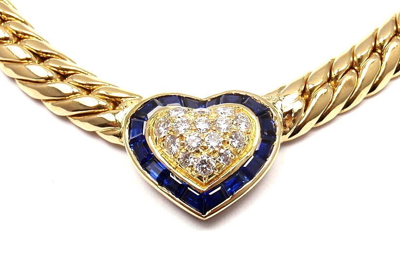 18k Yellow Gold Diamond and Sapphire Necklace by Van Cleef & Arpels. With 15 brilliant round cut diamonds, VVS clarity, E color. Total Diamond Weight: 3.04 carats, and 16 beautiful Sapphire Stones.

Details: 
Length: 16