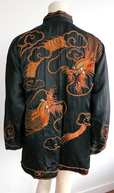 1930's era gold bullion embroidered silk chinese robe/jacket with metal round button frog closures.  Twin dragon artwork at back with chinese cloud and phoenix wing motifs at front
