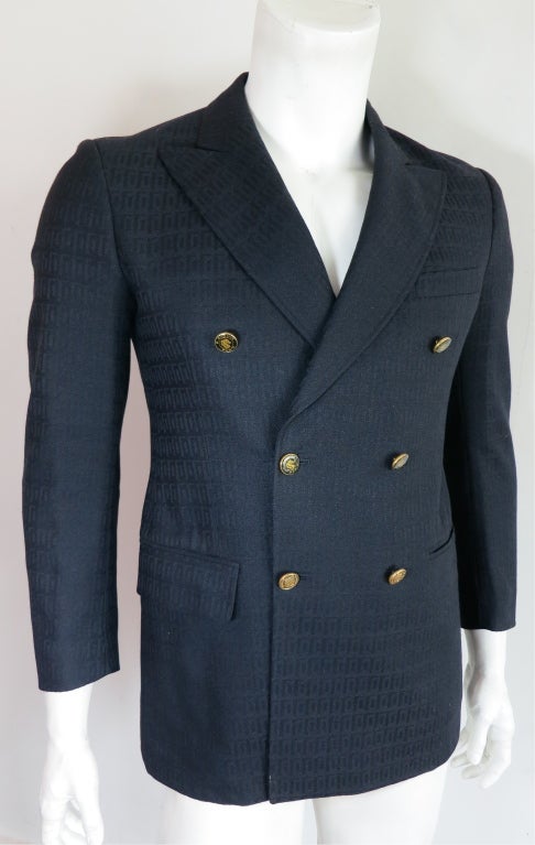 Vintage PIERRE CARDIN 1960's Geometric jacquard blazer in dark navy blue with epoxy logo button closures.  Bottom waist level flap pockets on both sides