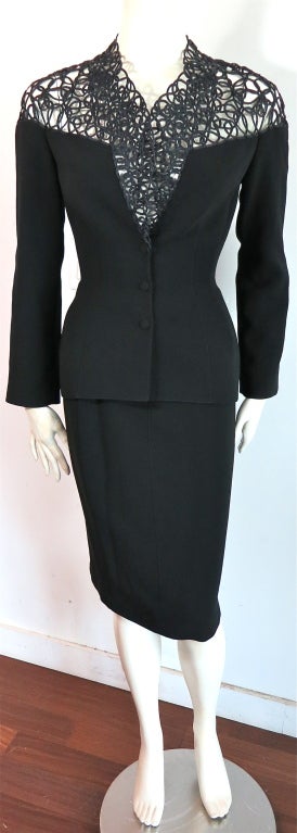 Vintage THIERRY MUGLER 1980's spiral rope detail skirt suit.  See through top spiral rope detailing with 'V' shape center front neckline.  Fabric covered snap down closures at front.  Ergonomic style front princess seaming with concealed side pocket