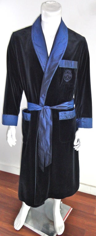 HERMÉS PARIS sapphire blue silk velvet embroidered men's robe with silk taffeta trims at lapel, pockets, cuffs, and waist sash.  Left chest embroidered medallion logo.  Fully lined in satin shadow stripe fabric