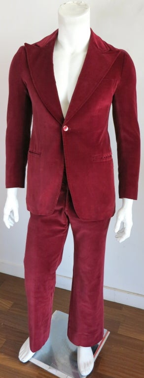 Vintage LANVIN PARIS 1970's burgundy velvet tuxedo suit.  Single button front closure with wide, peak lapels and dual, besom pockets at waist  Single back, vented construction.  Matching trouser with signature 70's style, flared silhouette. Underarm