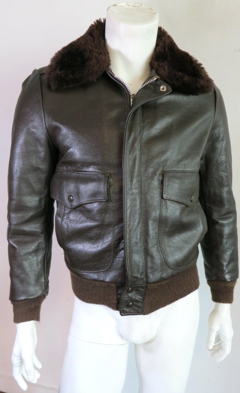 Vintage EXCELLED 1970's era leather aviator bomber jacket with faux fur lining and collar.  Dark olive knit rib trim at cuffs and hem