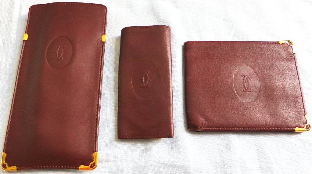 CARTIER PARIS leather trio wallet, key holder, and eyewear case