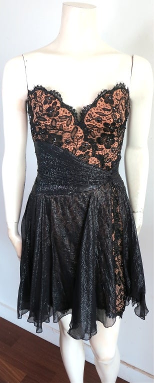Vintage BOB MACKIE 1980's jet black crystal embellished lace dress & jacket set.  The main dress is constructed of black floral, lace overlay with jet black crystal embellishments.  The bottom portion of the dress features sheer black Lurex chiffon