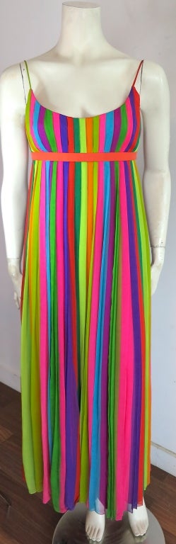 Vintage 1970's era silk chiffon, rainbow stripe pleated dress.  Empire waist silhouette with adjustable back belted closure, and concealed zipper entry.  Lined in pink silk crepe