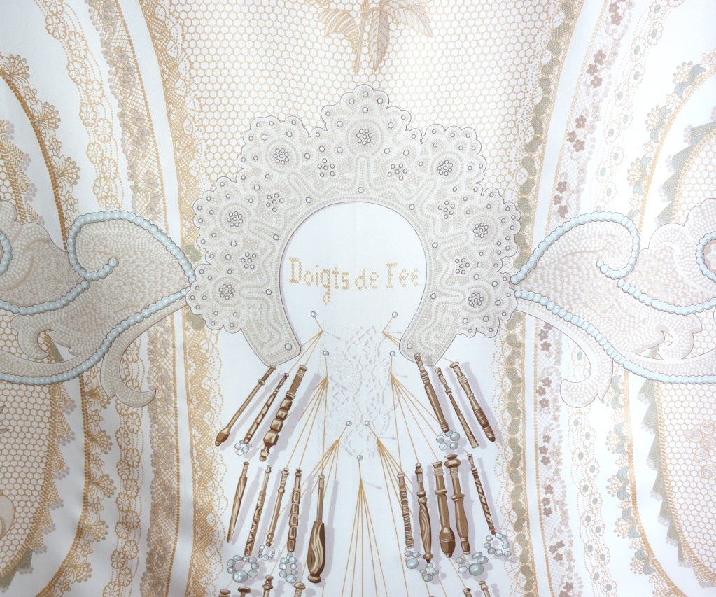 Unused HERMES PARIS 'Doigts de Fee' silk scarf featuring atelier, embroidery motif printed artwork in ivory, pearl gray, gold.  34